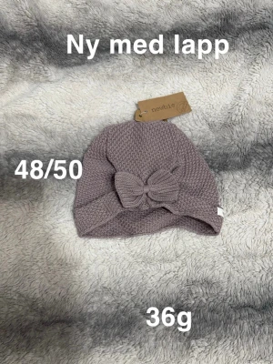 Newbie mössa - Ny med prislapp. Storlek 48/50