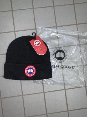 Canada Goose Beanie mössa - Mycket fin Canada Goose Beanie mössa. Oanvänd. Svart. No size