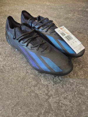 Adidas X Crazyfast.1 SG - Professionella adidas X Crazyfast.1 SG IG0905 fotbollsskor, storlek 40 och 2/3. Nya orginalskor med etiketter och orginalkartong.