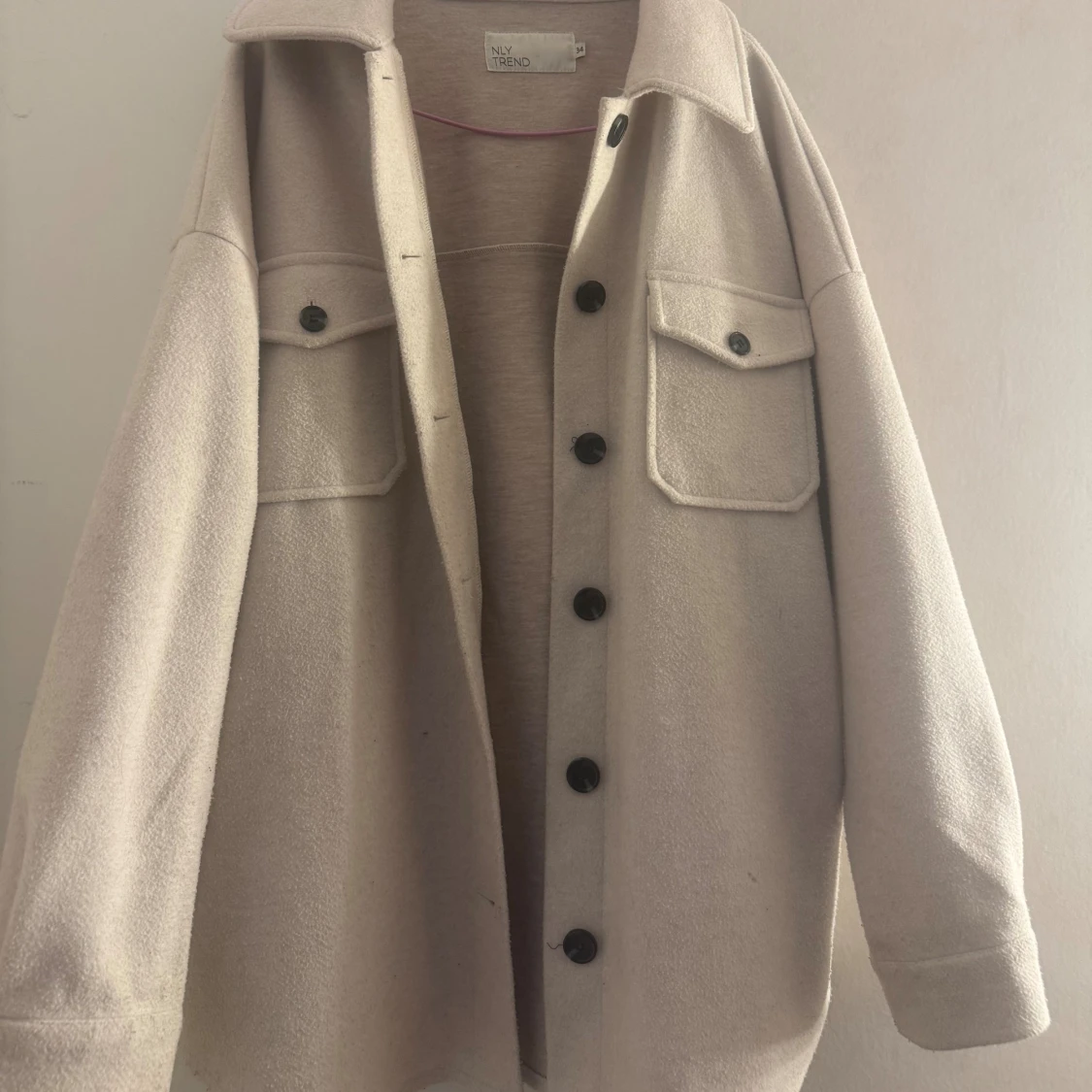 Beige kappa från NLY Trend