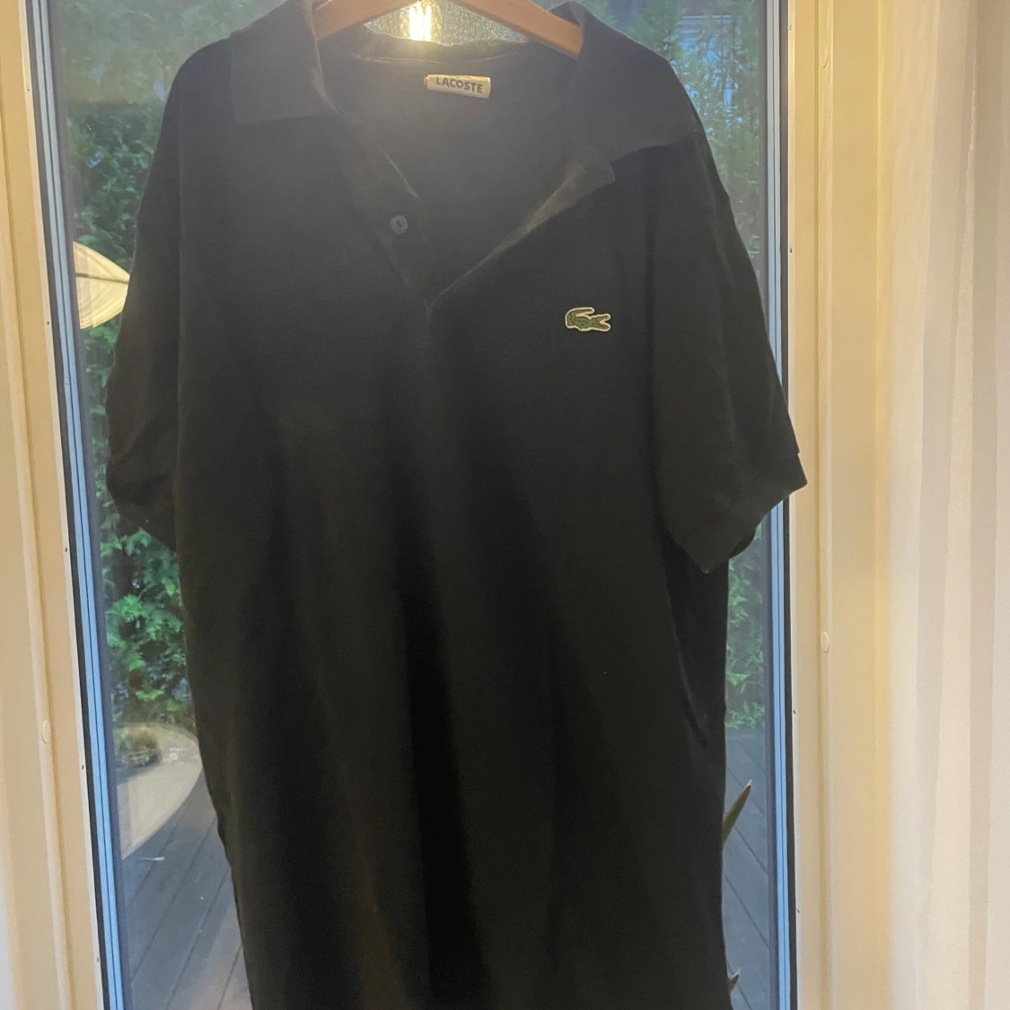 Svart pikétröja från Lacoste - 1