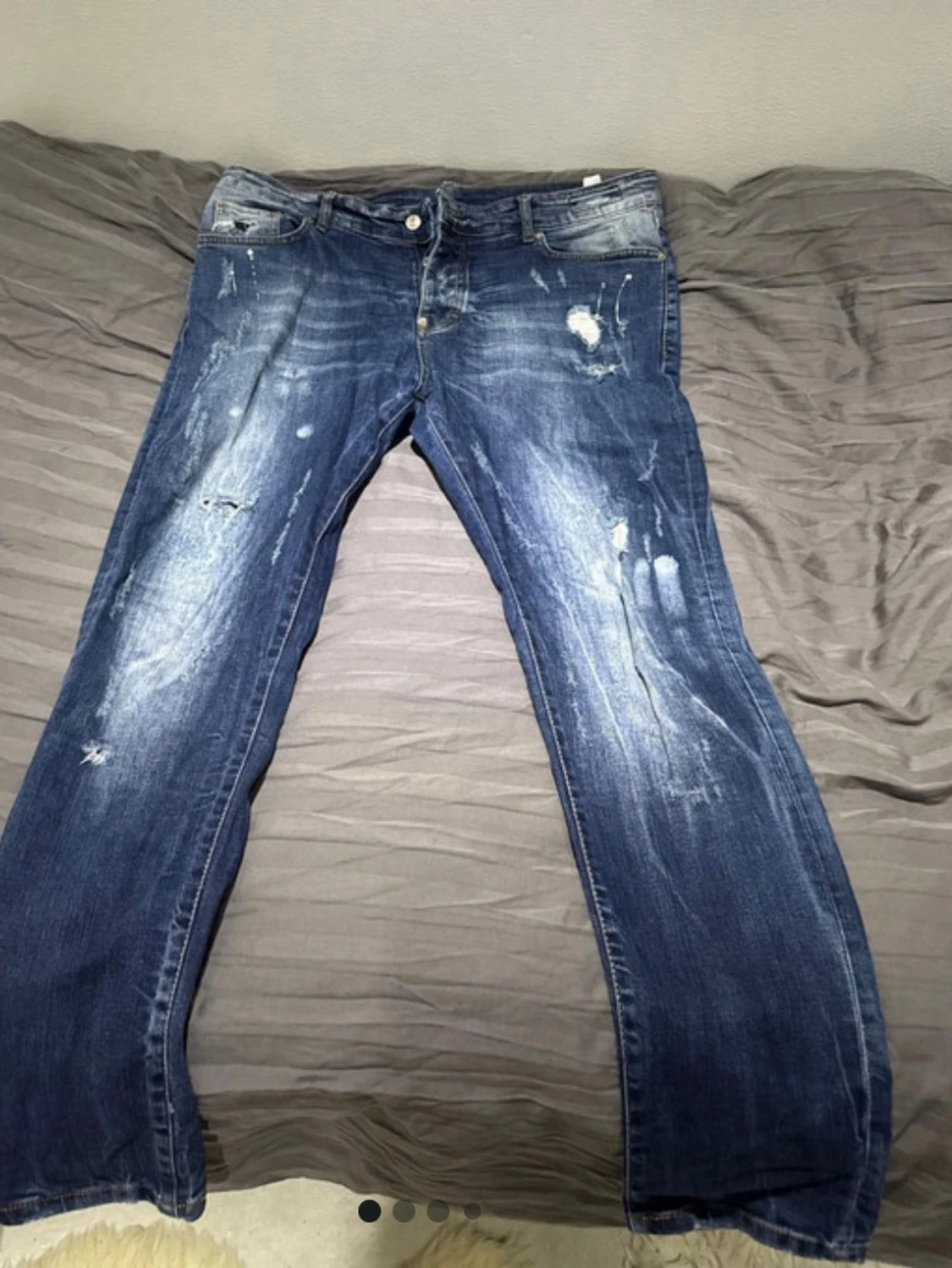 Blå Dsquared2 jeans med slitningar