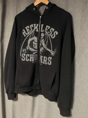 Reckless Scholars - Reckless zip svart.
