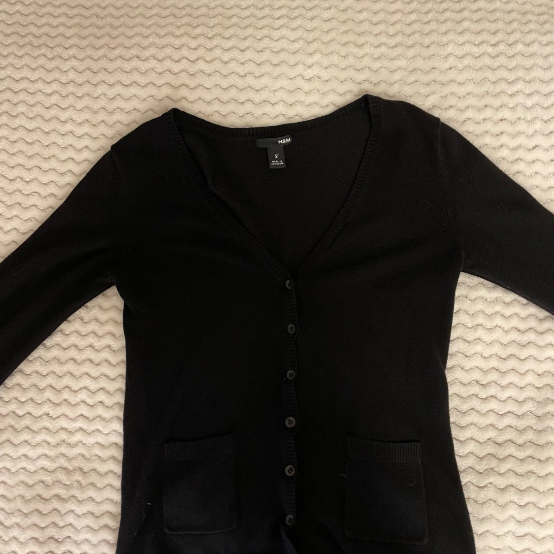 Svart kofta från H&M med fickor