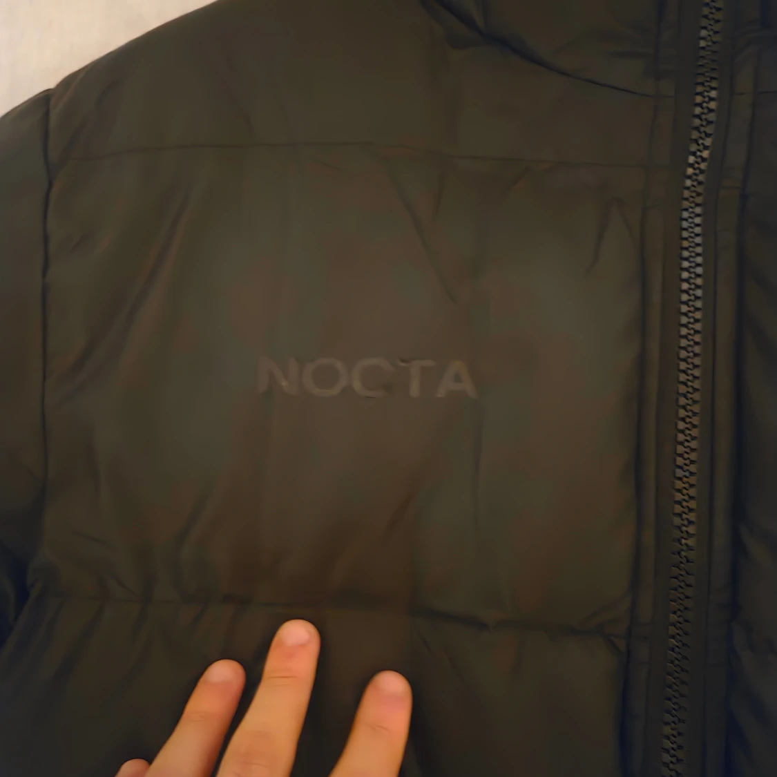 Svart NOCTA pufferjacka från Nike