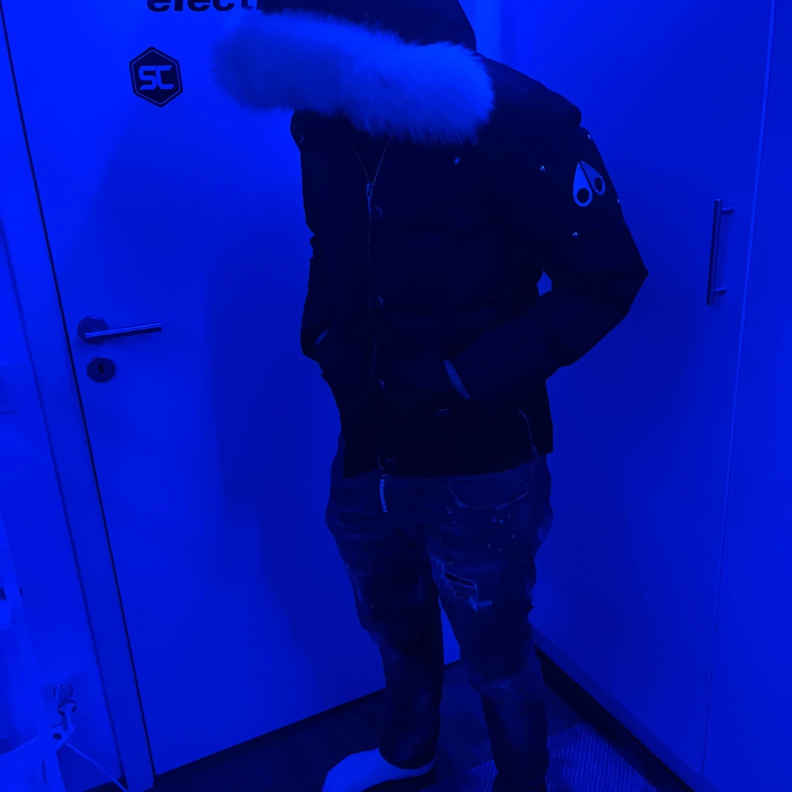 Moose Knuckles dunjacka med pälskrage