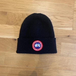 Canada goose beanie - Black Canada Goose beanie. Perfect for winter. Unworn.