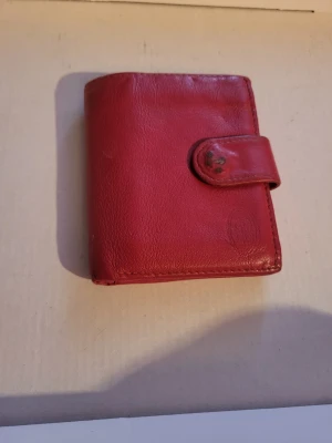 Leather wallet  - Good quality larger wallet. Several signs of wear, especially on the clasp, and one clear slot. Most aren't very noticible, but there is definitely noticble defects. 6 standard card slots, 2 clear card slots, 2 smaller pouches, 2 large pouches, 1 coin purse with zipper. Folded size 10x8x1.5cm Unfolded size 16x10x0.5cm Completely unfolded length 23.5  Bundle discounts: two items 10% off (automatic) three items 15% off, five items 20% off. Message me before purchasing 3+ items for discount.