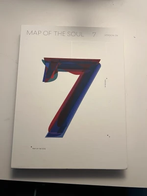 Map of the soul: 7 a BTS album - Map of the soul: 7 version 3, a BTS album that includes basically everything it came with except the stickers and the emblem and cash card. It bought for approximately 40€ or 400kr. It includes posters of the whole group and each member individually, photocard of one member, a coloring sheet, notes, the members signatures, a CD and a lyrics book.