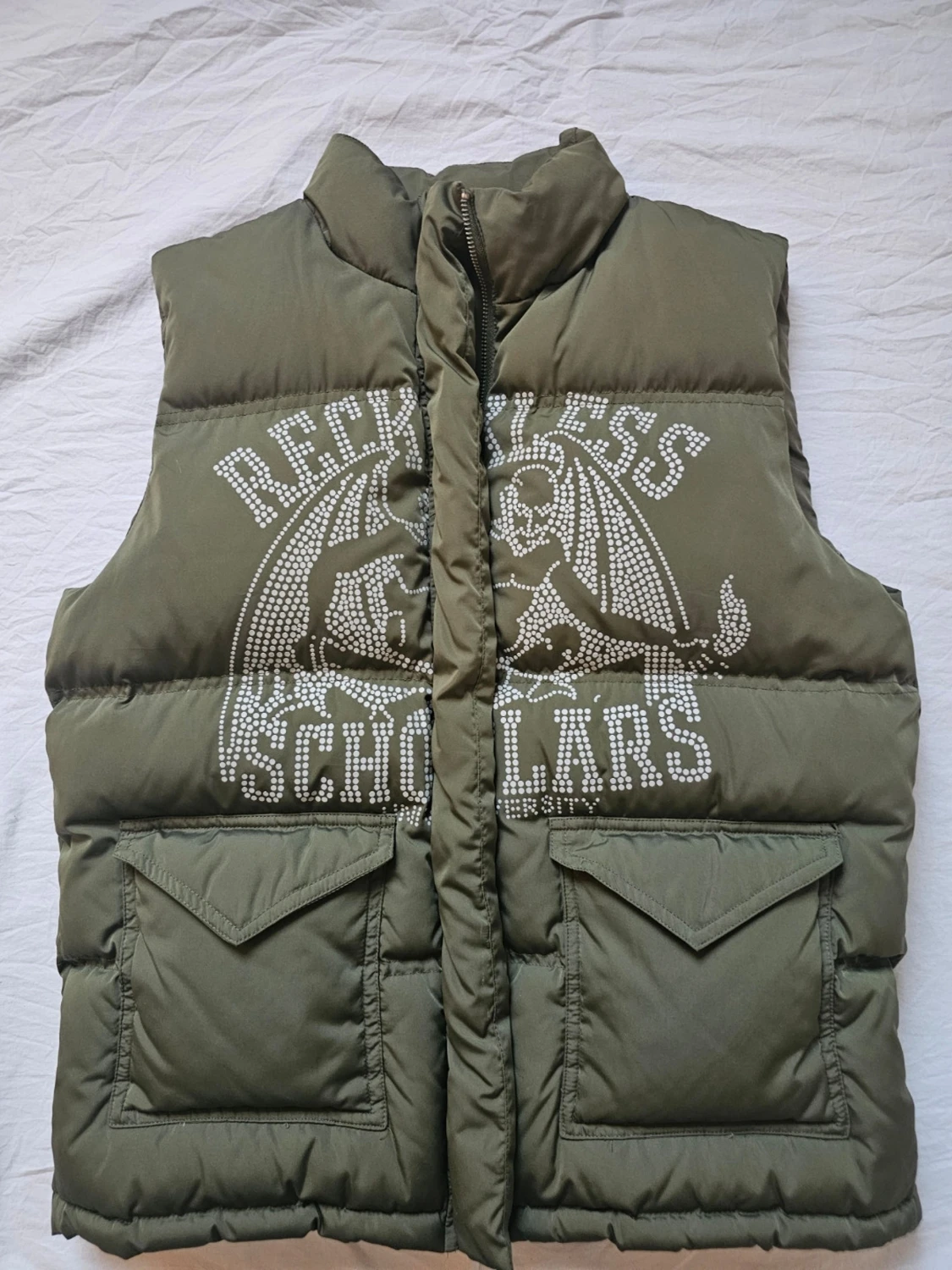 Olivgrön dunväst Reckless Scholars