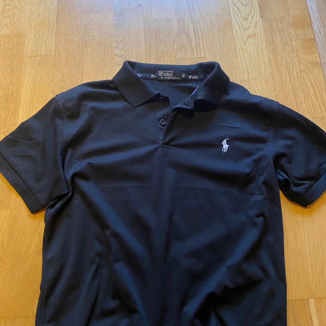 Svart pikétröja från Ralph Lauren