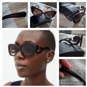 Svarta solglasögon från Prada - Snygga svarta solglasögon från Prada med unika, snirkliga skalmar. De har en elegant cat-eye form och mörka linser som ger ett stilrent intryck. Perfekta för att lyfta vilken outfit som helst med en touch av lyx.