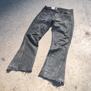MARES TKVR “WAXED FLARE” - HANDCRAFTED FROM LEVIS 501 BLACK DENIM WITH A DISTINCTIVE WAXED FINISH.