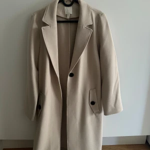  Beige kappa från H&M -  Normal storleken 