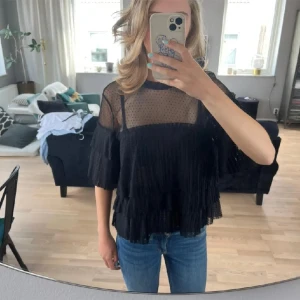 Blus - Blus i uppskattad storlek s/m