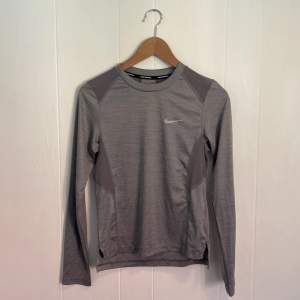 Long sleeve Nike running shirt. Only use a few times. 