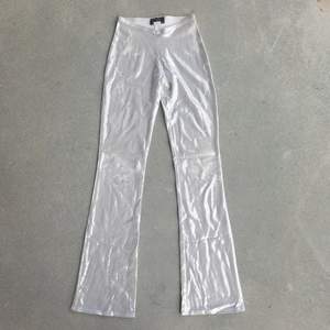 Super gorgeous fit, silver sparkly flare pants. Made in New York City. Small wear on the sparkly design in some areas but it doesn't take away from the gorgeous y2k energy. Matching top sold in separate listing!