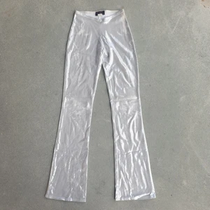 True Vintage Y2K Silver Flare Pants - Super gorgeous fit, silver sparkly flare pants. Made in New York City. Small wear on the sparkly design in some areas but it doesn't take away from the gorgeous y2k energy. Matching top sold in separate listing!