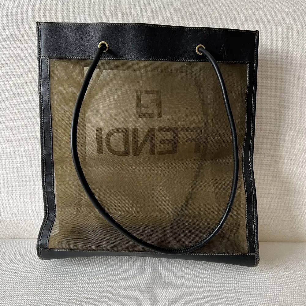 Posting from Latvia! Authentic Fendi mesh tote bag. The condition is good. No dirt, holes, although the leather trims as well as bottom corners shows little signs of wear. Instagram @Bagotheque. Laukut & Käsilaukut.