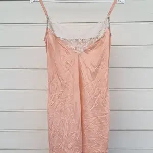 Its a light pink night garment that used to be white but dyed pink. The color doesn't fit my style but I've never worn it.
