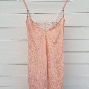 Light Pink Night Garment - Its a light pink night garment that used to be white but dyed pink. The color doesn't fit my style but I've never worn it.