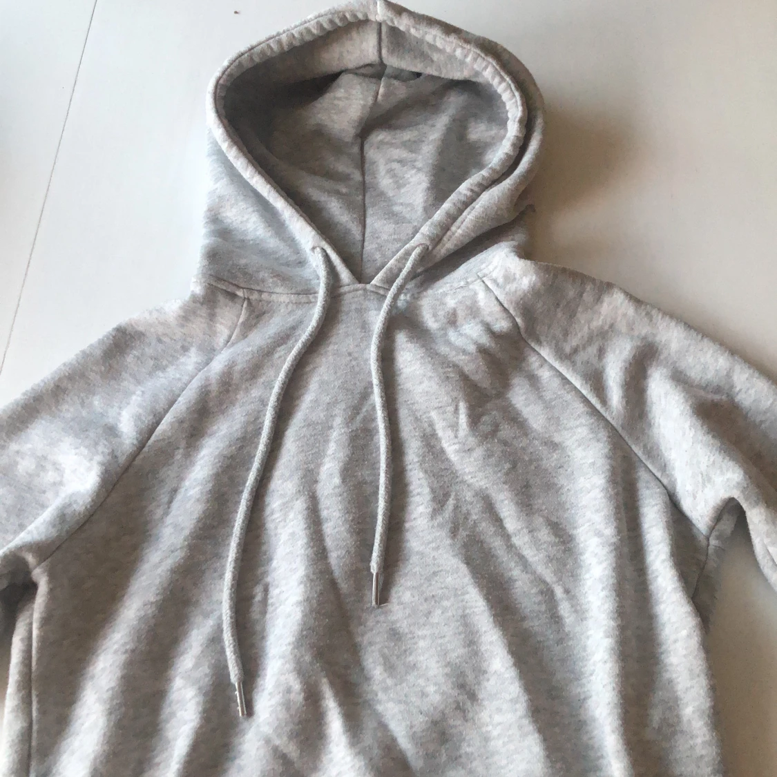 En grå hoodie från H&M i storlek S