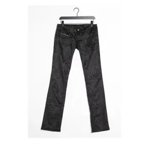Supercoola svarta lågmidjade byxor med mönster, köpta på Zalando