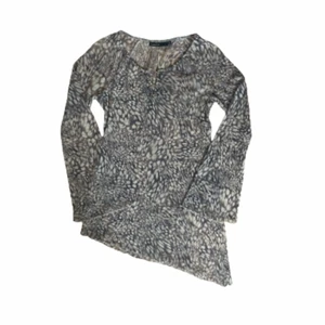 Meshtopp - Snedskuren meshtopp i melerat tyg med knytdetaljer. Väldigt y2k! Från Kappahl i storlek 34/36 