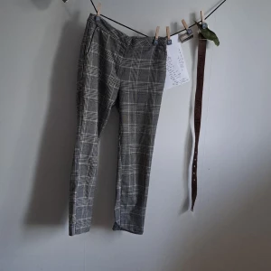 Checkered Punk Trousers - Cool punk checkered black/grey and white trousers.  Fits like a size 34/xs. 