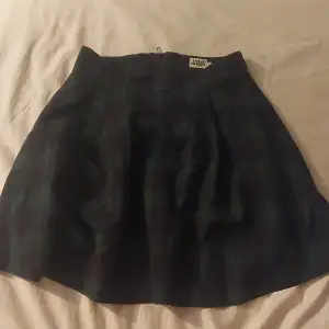 School girl skirt. Black and green. Puffy.