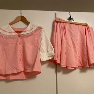 Kawaii two piece - Only used once. Very good condition. I used it for cosplaying my melody. Size M. Cats in home. It’s a two piece that includes shirt and skirt. 