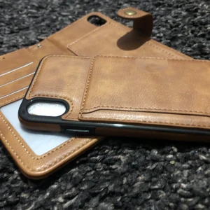 Ny Plånboksfodral till iPhone X  2 delar skinn/ brun - En ny Plånboksfodral till iPhone X 2 delar  Färg:brun Allt är som mina bilder