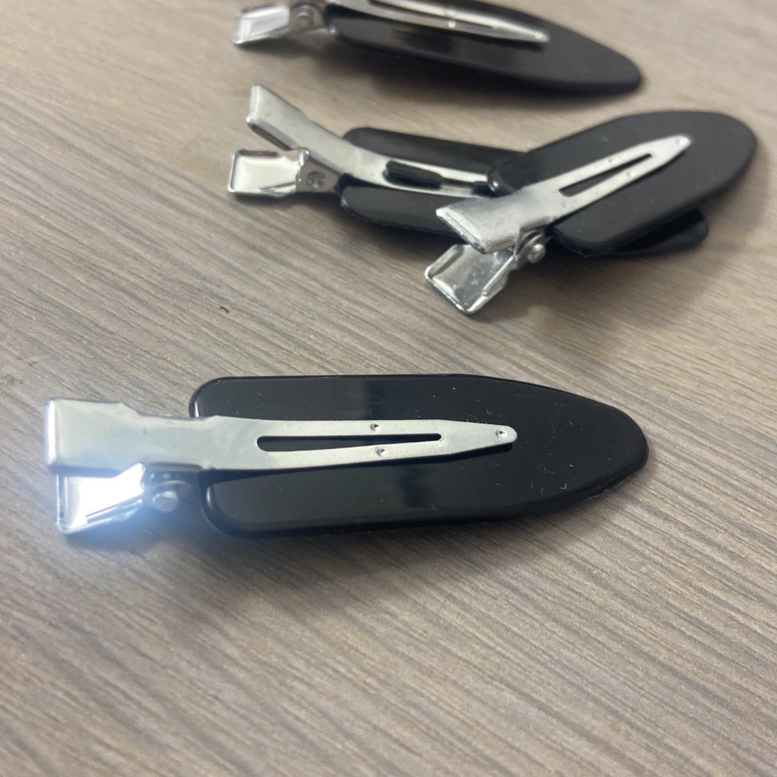 Svarta hårspänne från normal  - 90