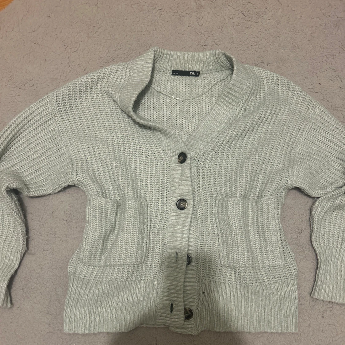 Stickad turkos kofta