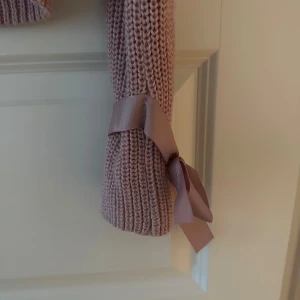 Rosa stickad tröja  - Fint skick 