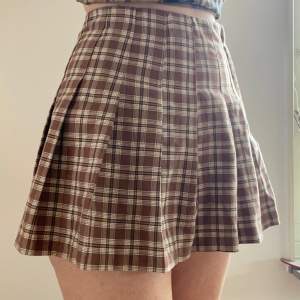 Brown plaid tennis skirt.