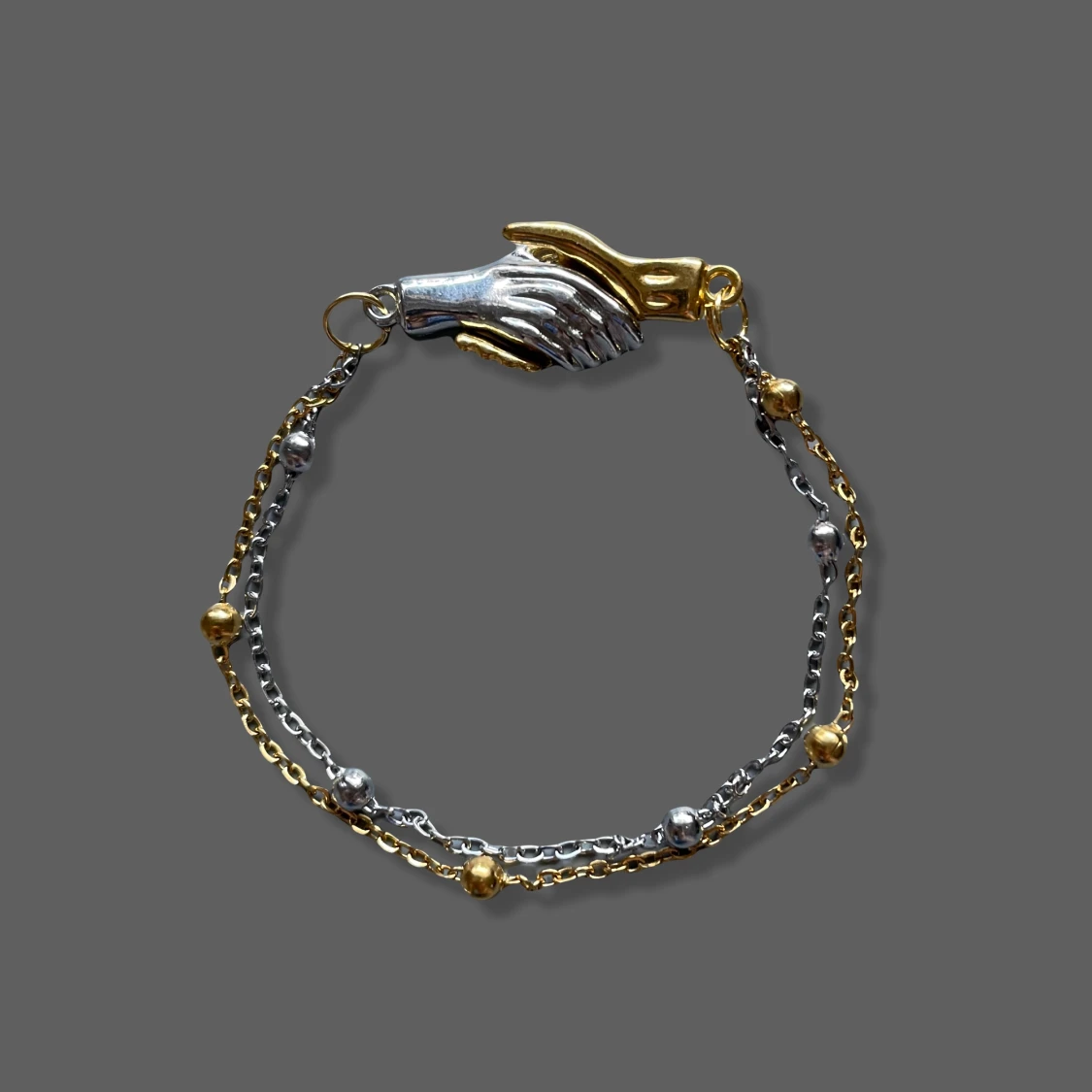 Gold and silver hands and chain