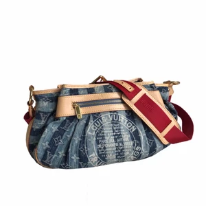 LOUIS VUITTON Monogram Denim Cruise Porte Epaule Raye MM - This Limited Edition denim monogram bag from Louis Vuitton was a collaboration with Marc Jacobs for the 2007 Cruise Collection. There were only 30 left for sale in the US when I bought it in Dec of 2006. Only carried about a dozen times, it is in pristine condition.       FREE SHIPPING Measurements Length: 15 in Width: 6 in Height: 9 in