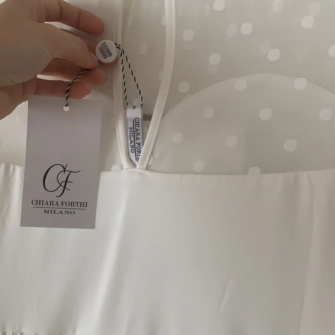 Klänning, oanvänd, vit från dennismaglic. - 91