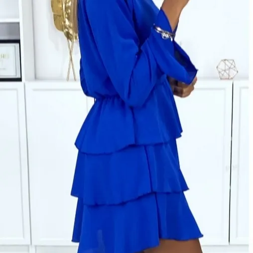 Long-sleeved crossover dress in royal with flounce at the bottom, 100% polyester. Klänningar.