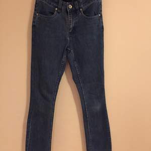 Stretch jeans trousers. They are tight and loose in the end. 70,s style.