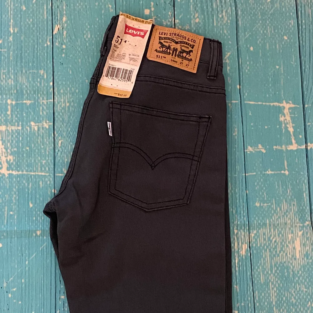 New with Tag! Original Price: $42.00 Black Slim Fit Tapered Jeans with straight leg, non-stretch, size 14 regular 27x27 be sure your true to size. . Jeans & Byxor.