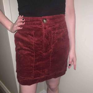 Lovely dark red color, great with tights under or boots