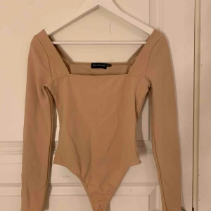  - Helt ny bodysuit i mycket fint skick. 