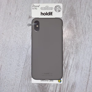 HOLD IT - skal X/XS - Helt nytt skal i originalförpackning. Passar iPhone X/XS. I silikonmaterial. Kan skickas mot fraktkostnad. Fler bilder kan ordnas om önskas. 