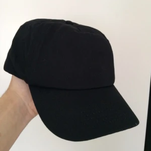  - clean, svart baseball-keps från reclaimed vintage.

oanvänd 