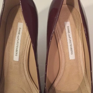 - 4 year old DVF burgundy high heels, worn once (too high for this old grandma!) 