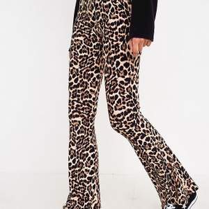 super cute leopard print flare pants. selling because they are too short for me but they would fit a size M-L