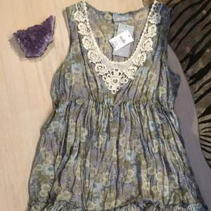 Brand new floral, see through dress from a British brand, Wallis. Size M. Good as a gift too!