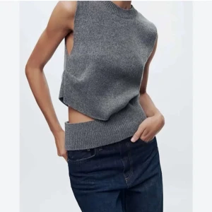 Stickad väst - Grå stickad väst med cut out